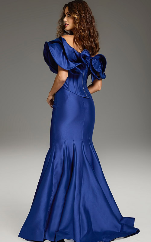 Model wearing Jovani 40324 purple mermaid gown with ruffle details, back view
