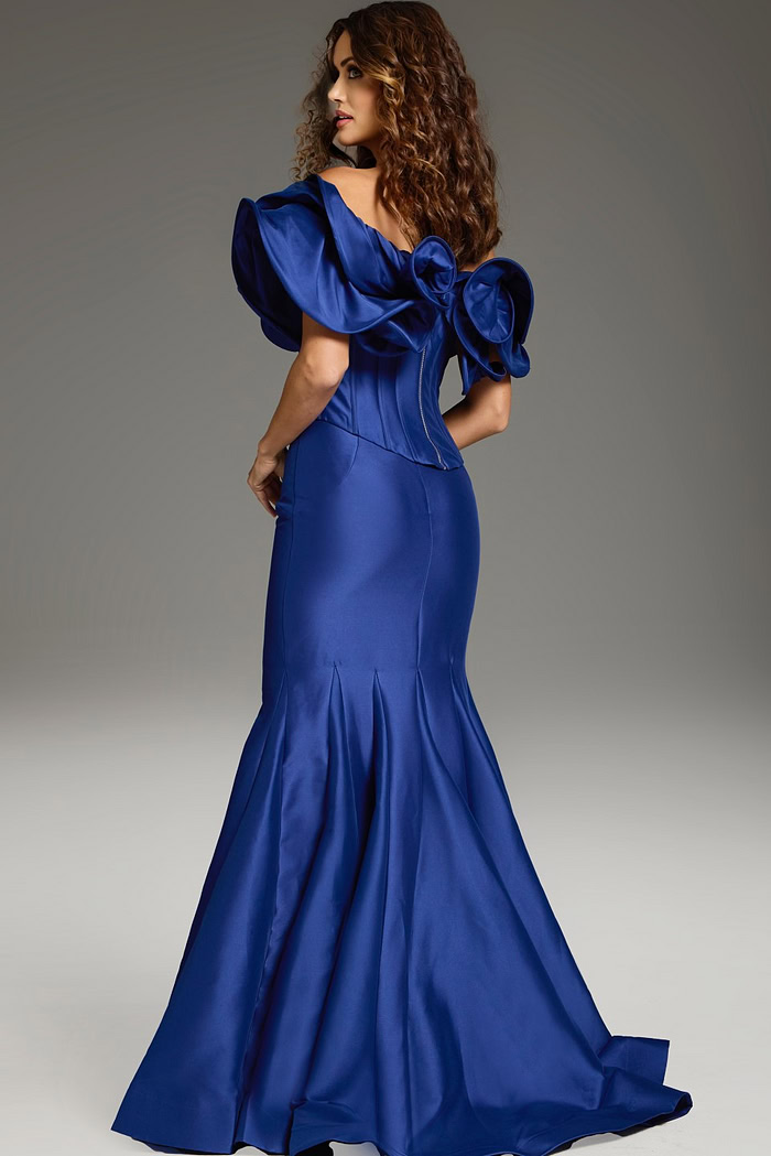 Model wearing Jovani 40324 purple mermaid gown with ruffle details, back view