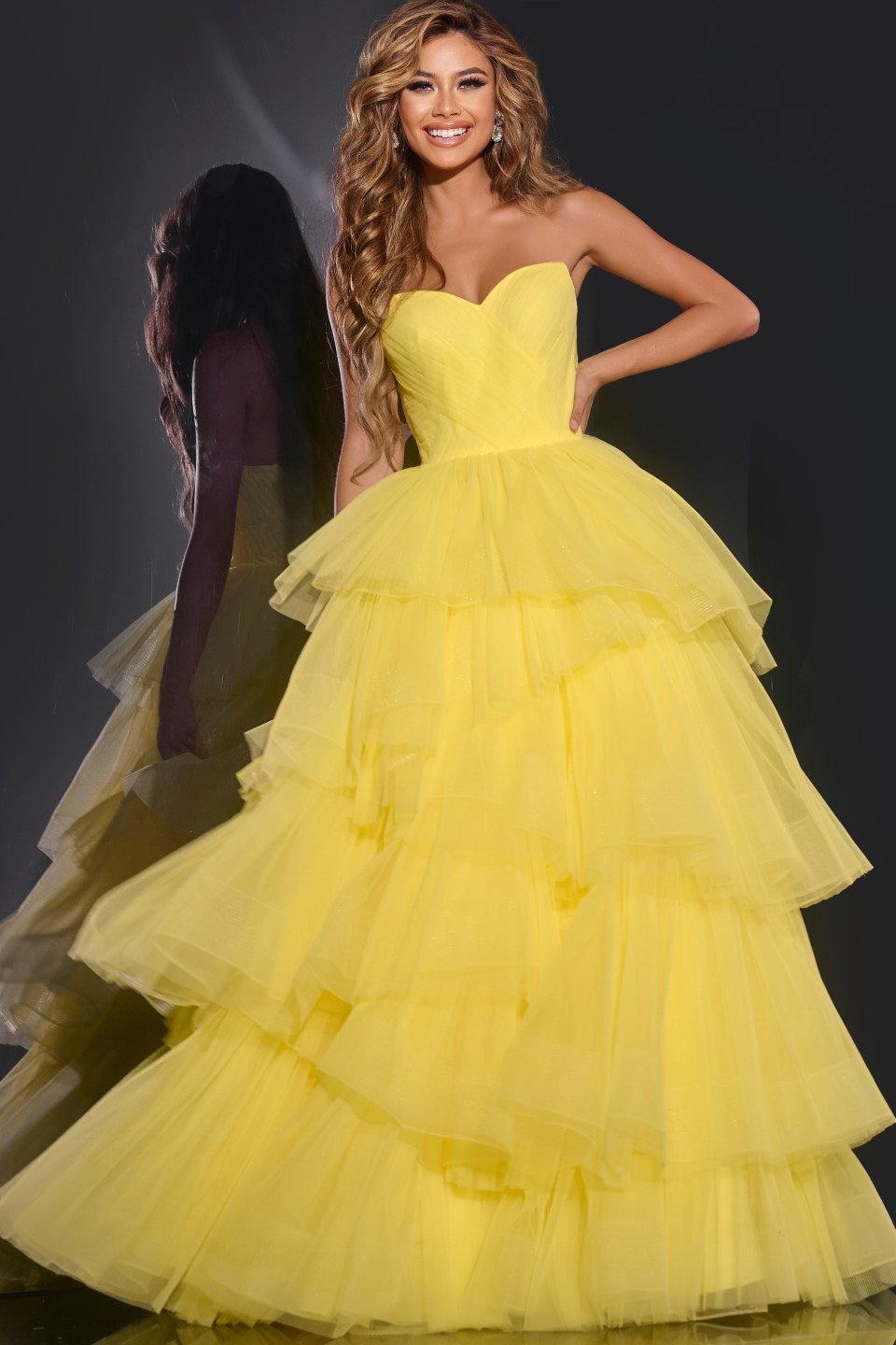 Model wearing Jovani 40394 yellow ball gown with sweetheart neckline.