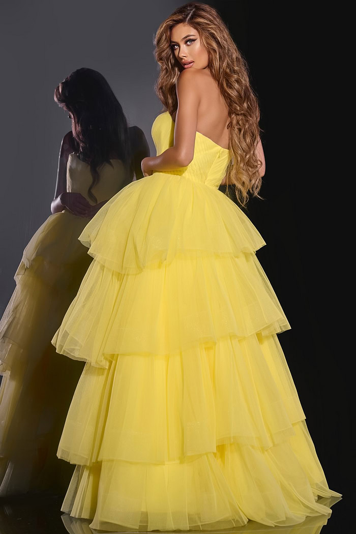 Model showing the back view of Jovani 40394 yellow ball gown.