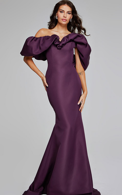 Model wearing Jovani 40596 burgundy gown with off-the-shoulder ruffled neckline and mermaid silhouette.