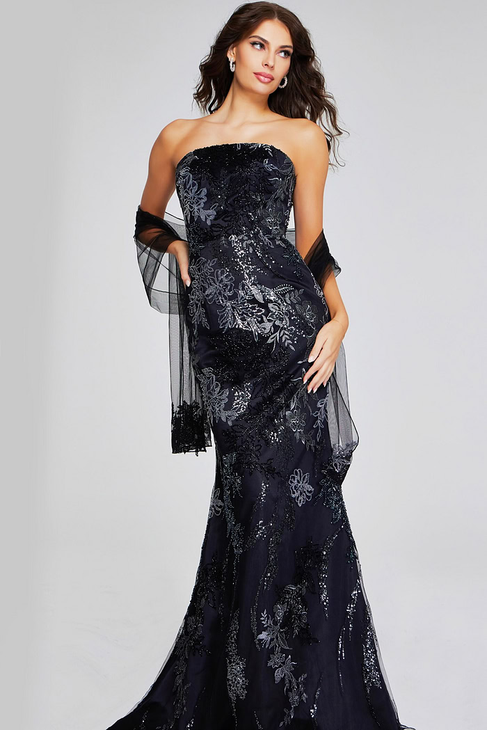 Model wearing Jovani 40604 black gown featuring sequin embellishments, front view.