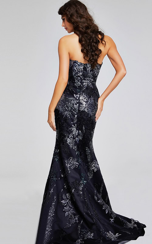 Model in Jovani 40604 black dress with floral design, back view showcasing mermaid silhouette.