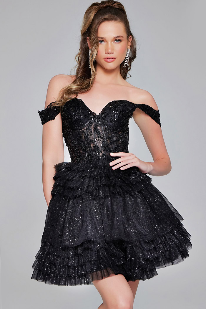 Model sporting Jovani 40612 black dress with sparkling details and sweetheart neckline.