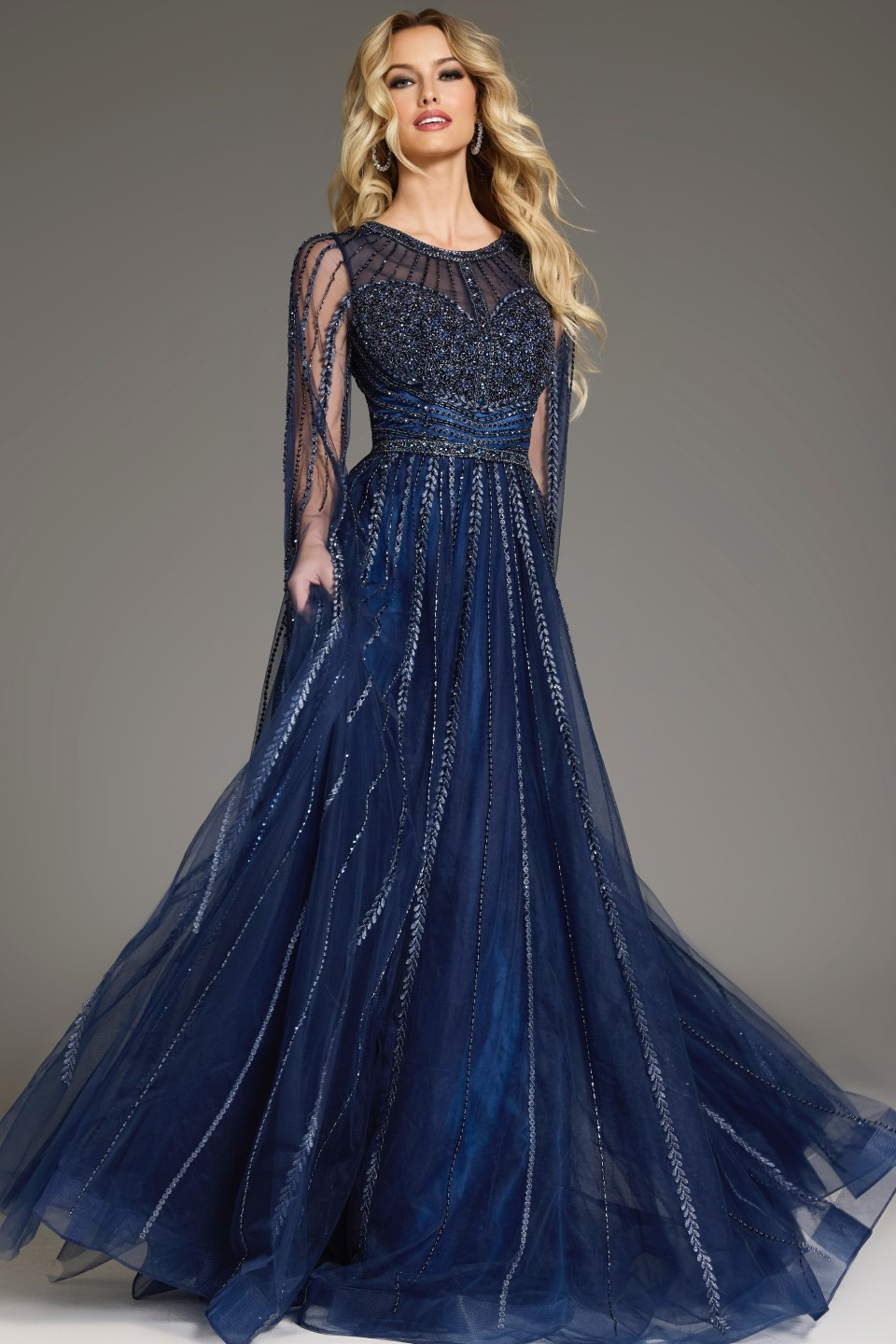 Model in Jovani 40629 navy gown with flowing A-line silhouette.