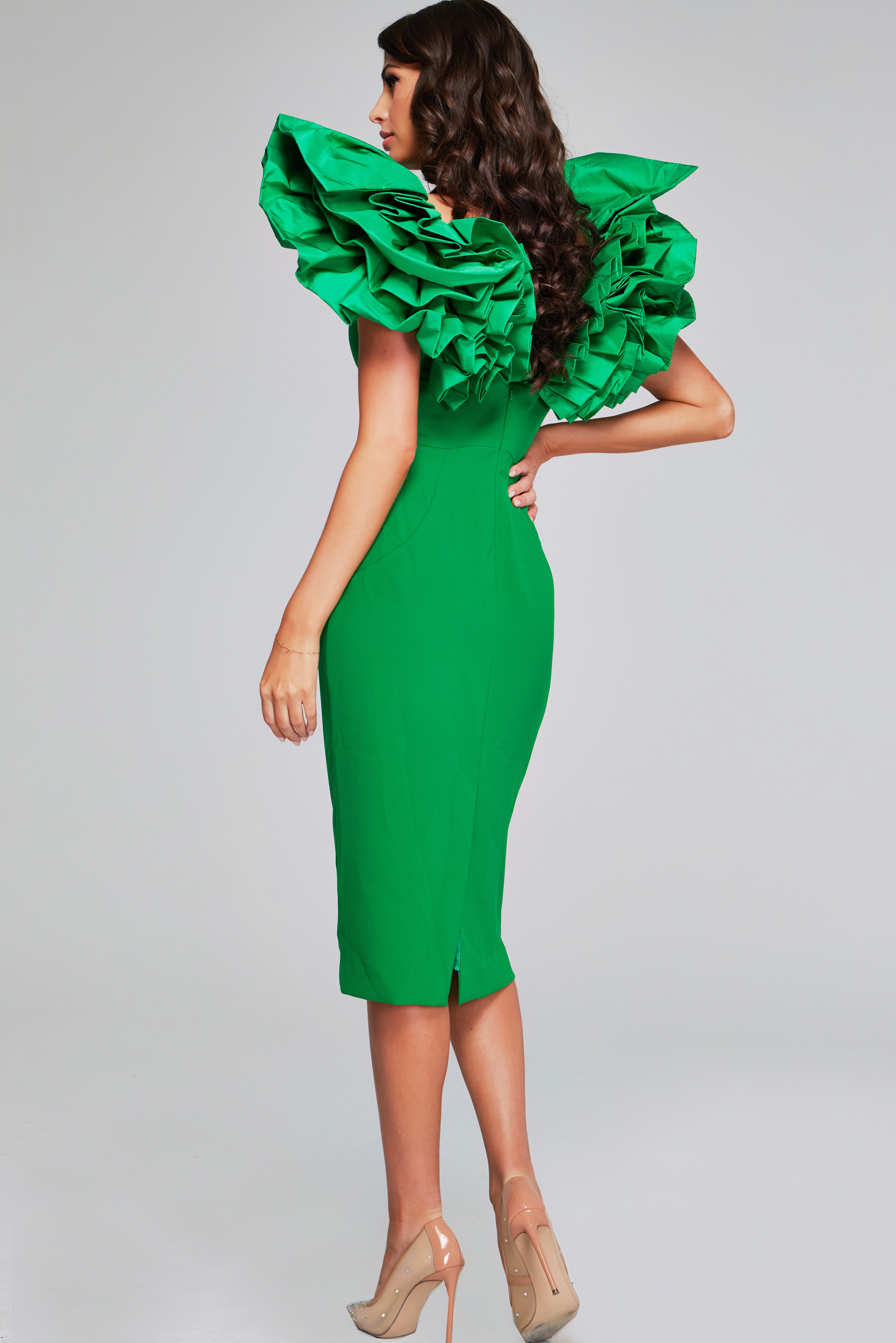 Model wearing Jovani 40662 showing back details of emerald dress with ruffled sleeves