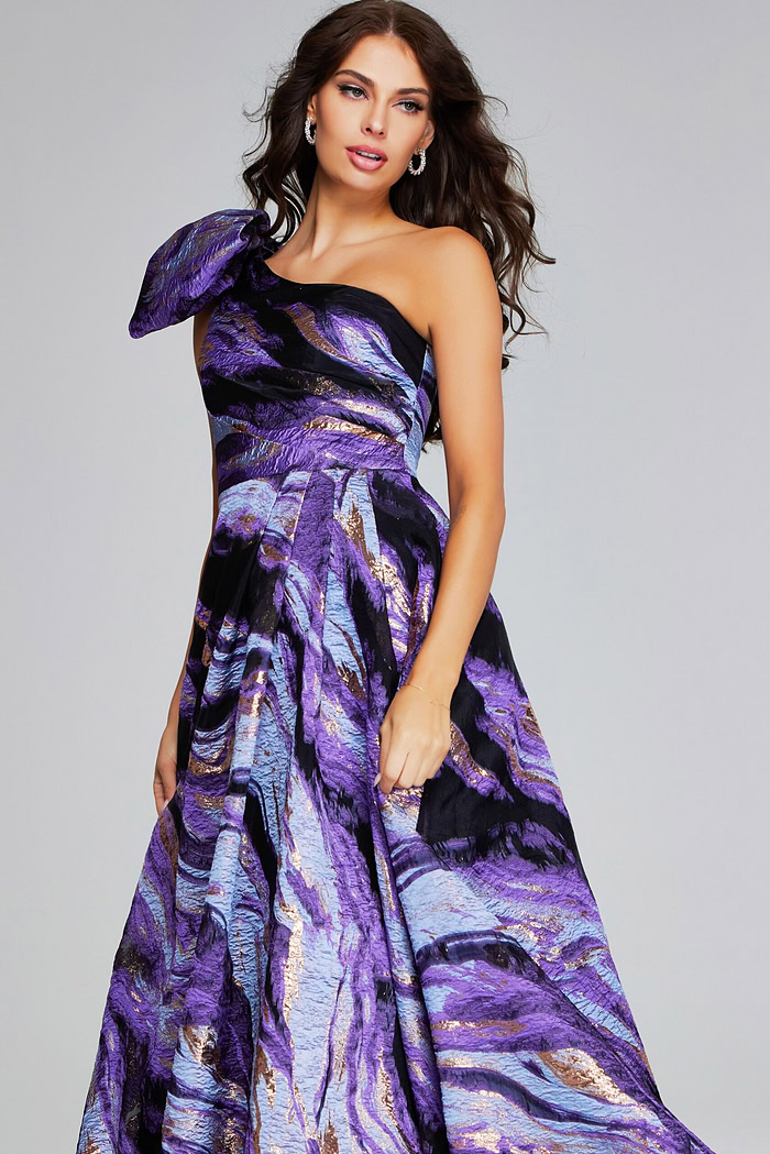 model wearing Jovani 40695 purple gown, showing front view with dramatic bow accent