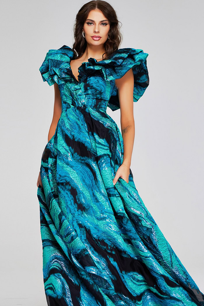 Model wearing Jovani 40696 blue gown with dramatic ruffled sleeves, front view.
