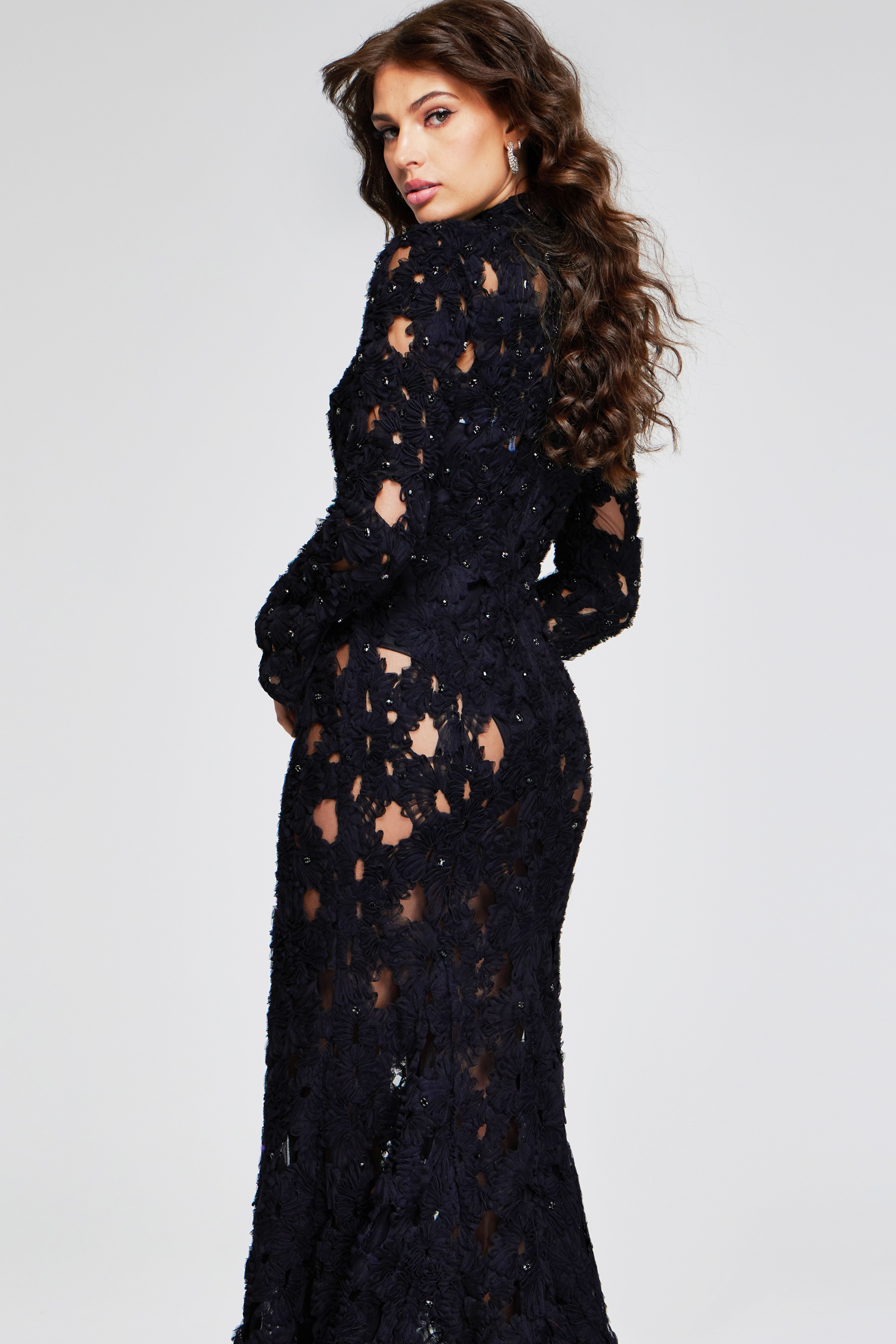 Side view of Jovani 40743 black lace gown, highlighting the gown