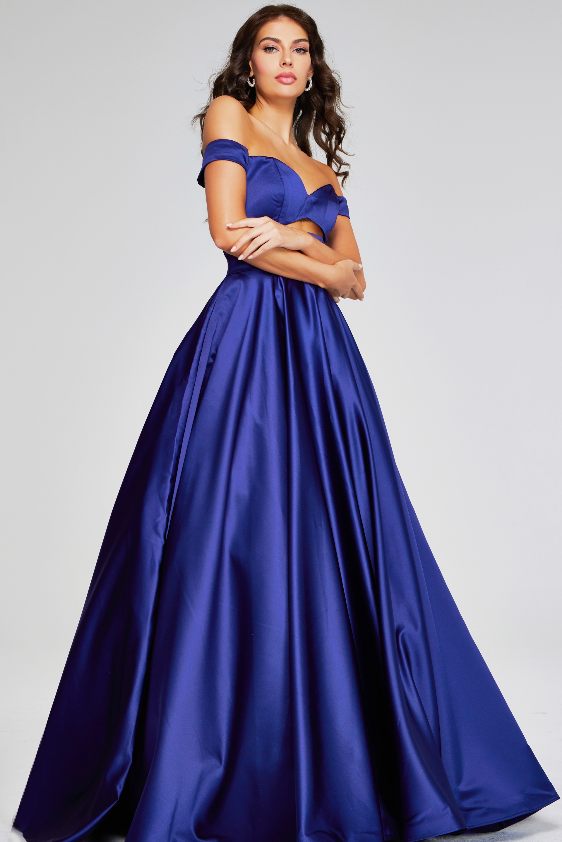 Model wearing Jovani 40787 purple off-the-shoulder dress, front view close-up.