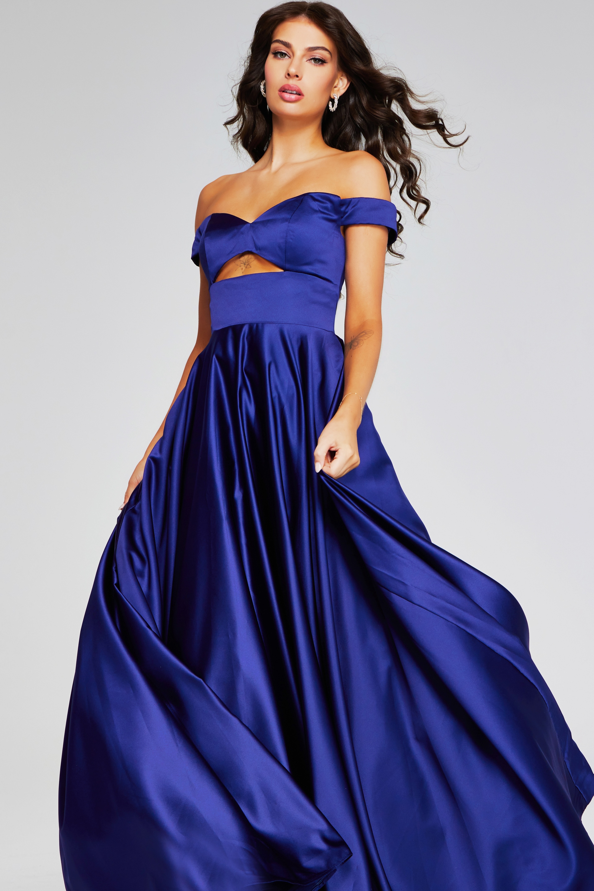 Model wearing Jovani 40787 purple off-the-shoulder dress, front view.