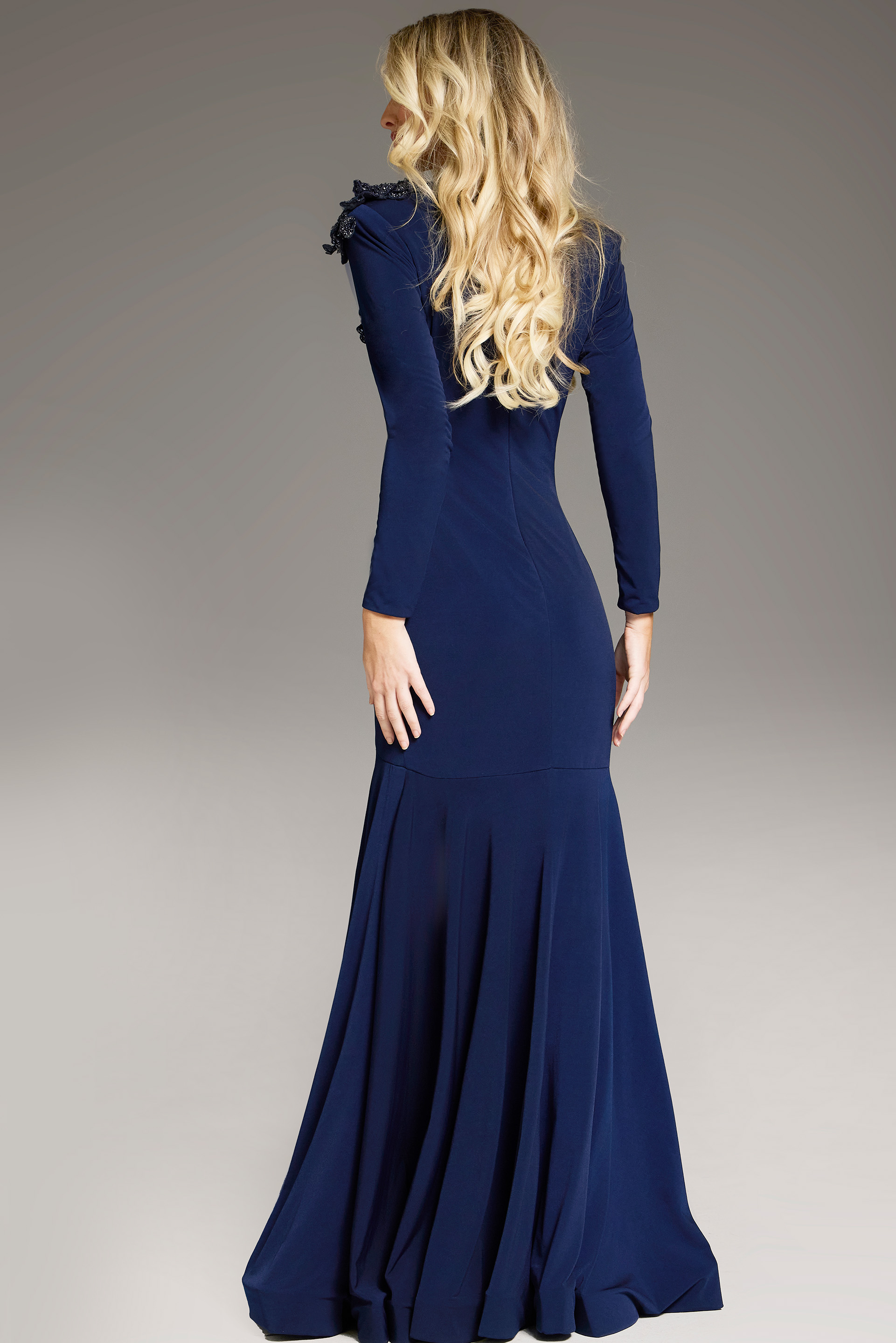 Back view of model wearing Jovani 40926 navy dress with mermaid silhouette.