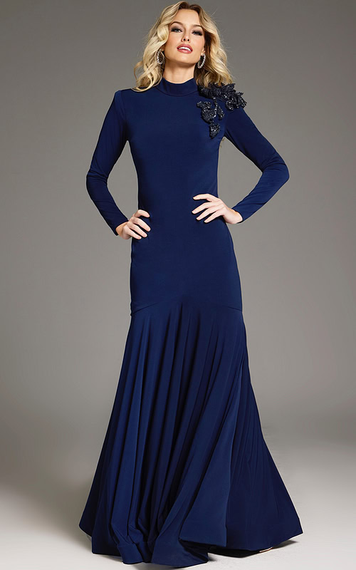 Model wearing Jovani 40926 navy dress with mermaid silhouette and floral embellishment from the front.