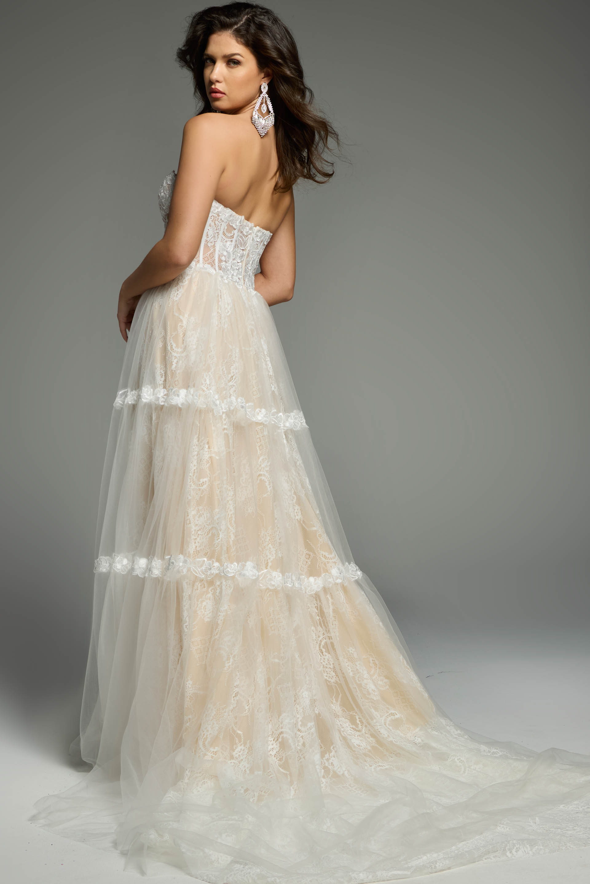 Back View Of Tiered Tulle Bridal Gown With Sheer Corset Bodice