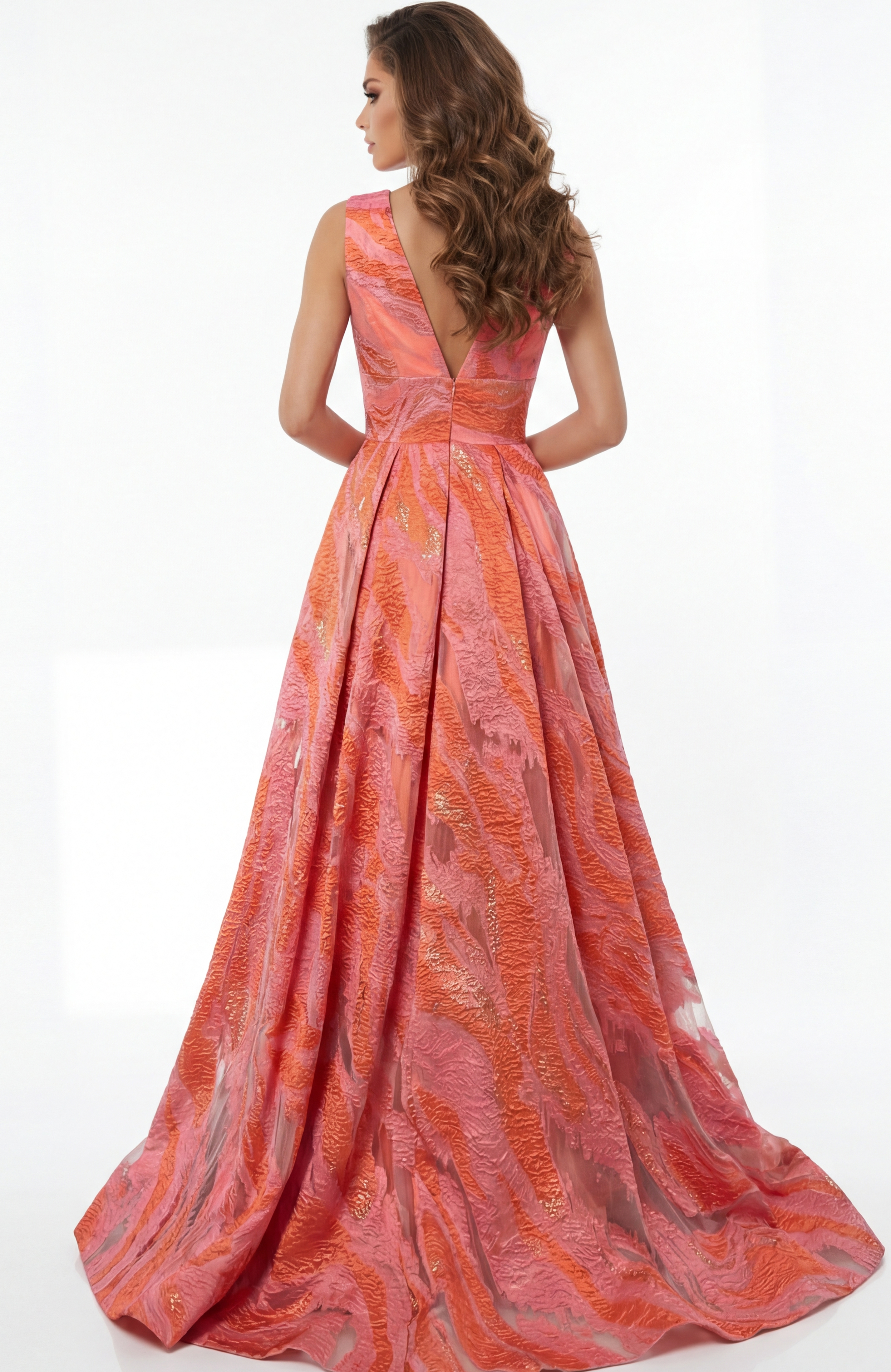A line gown with open V back and flowing floor length skirt