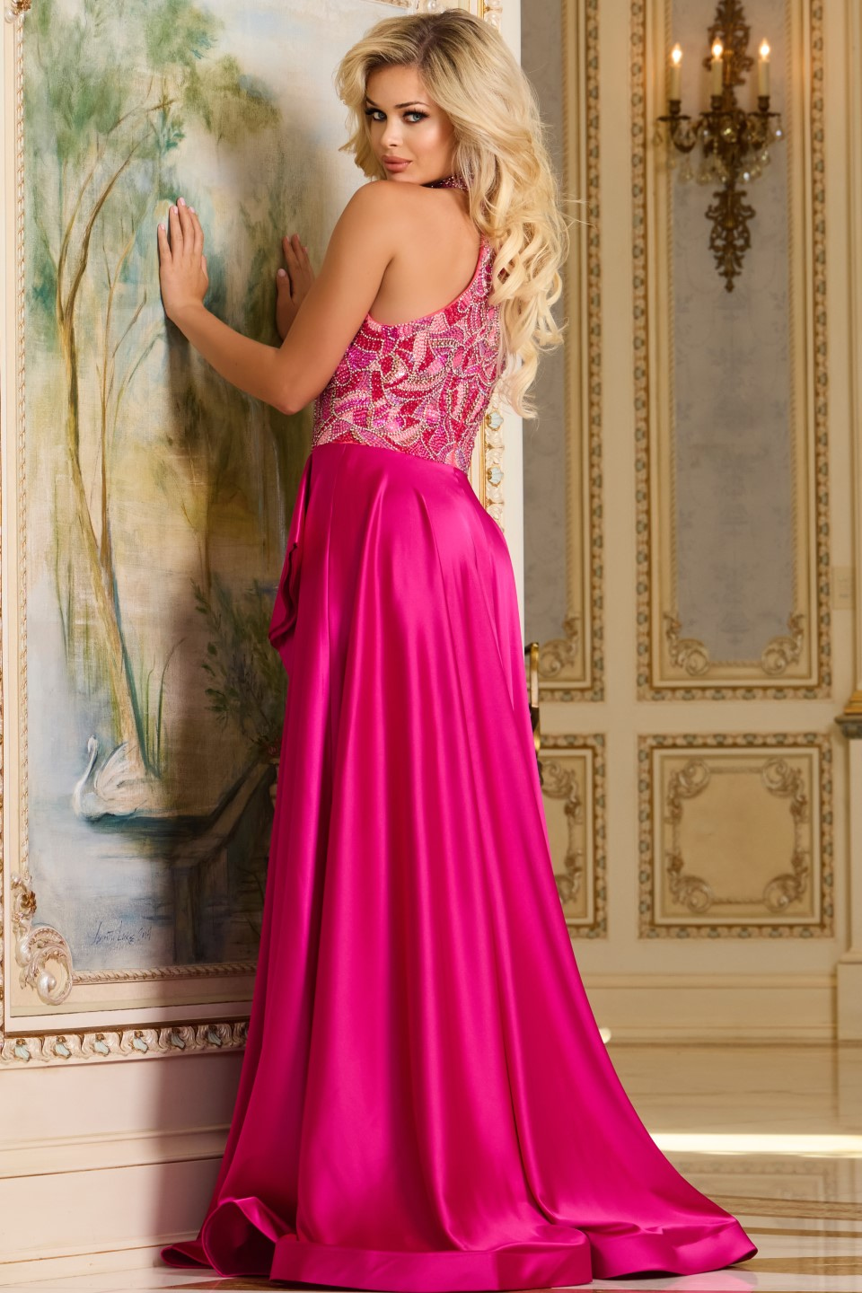 Model wearing Jovani 41186 fuchsia gown with embellished bodice, back view