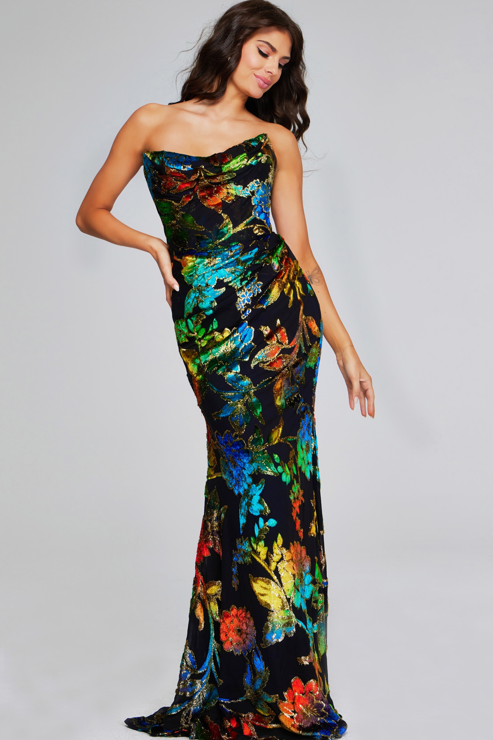 Model posing in a Jovani 42164 multi-color floral gown, front view.