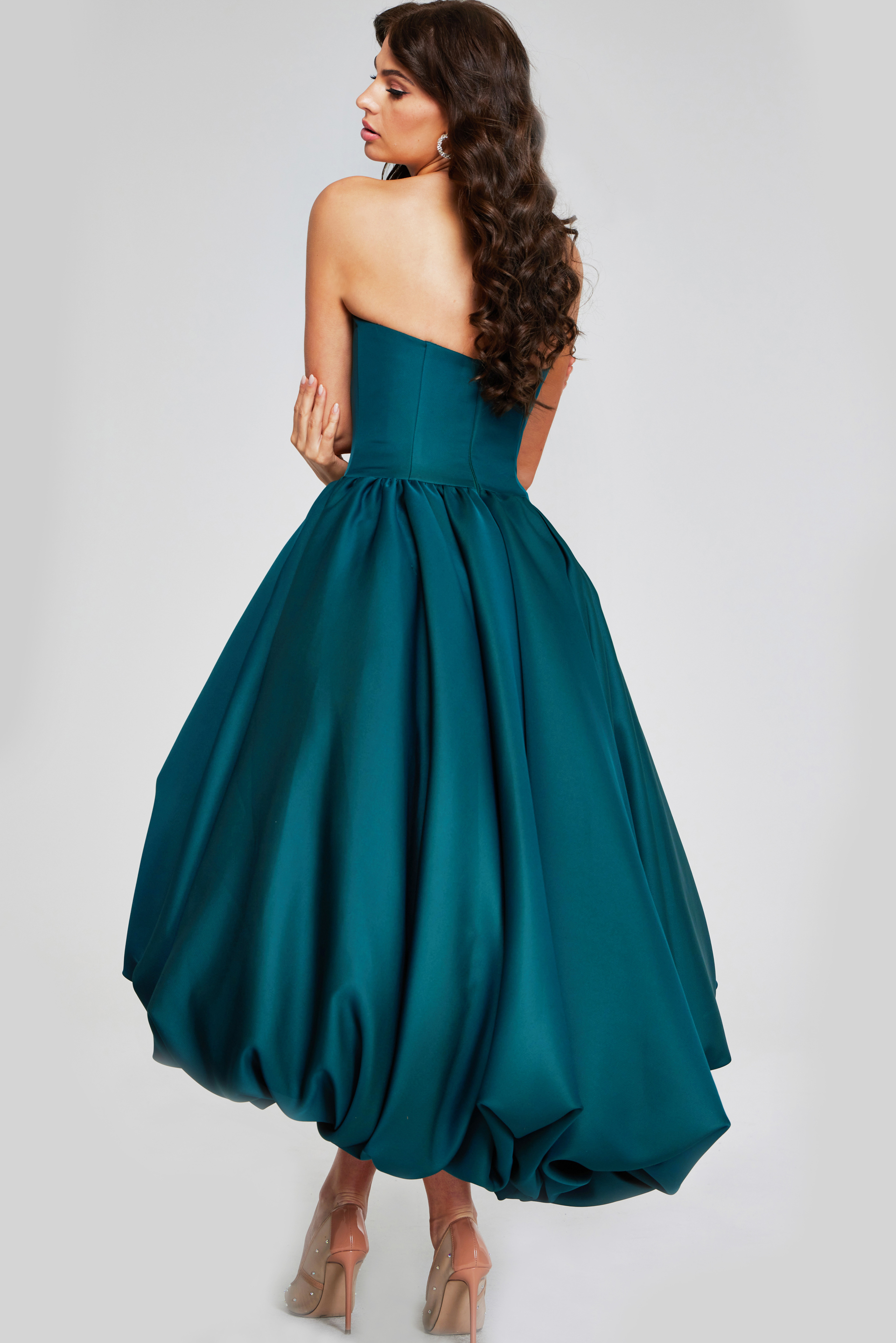 model wearing Jovani 42345 dark green strapless high-low dress back view