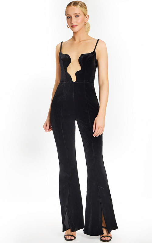 Front view of black velvet jumpsuit with deep wavy plunging neckline