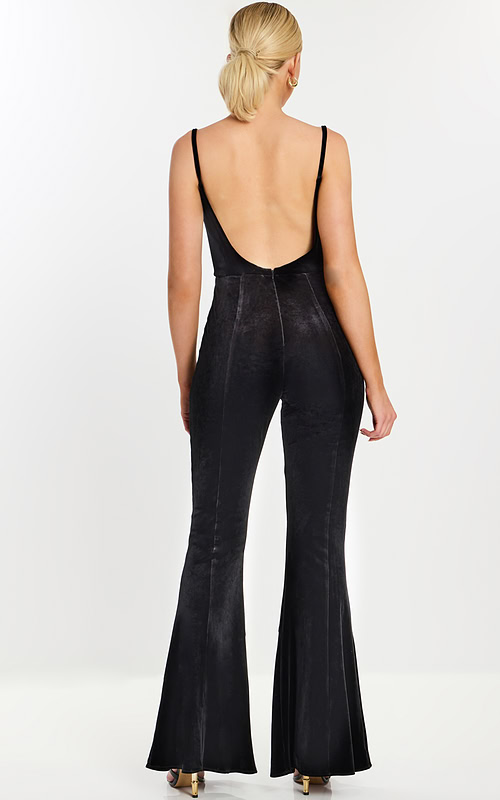 Back view of sleeveless black jumpsuit with low open back
