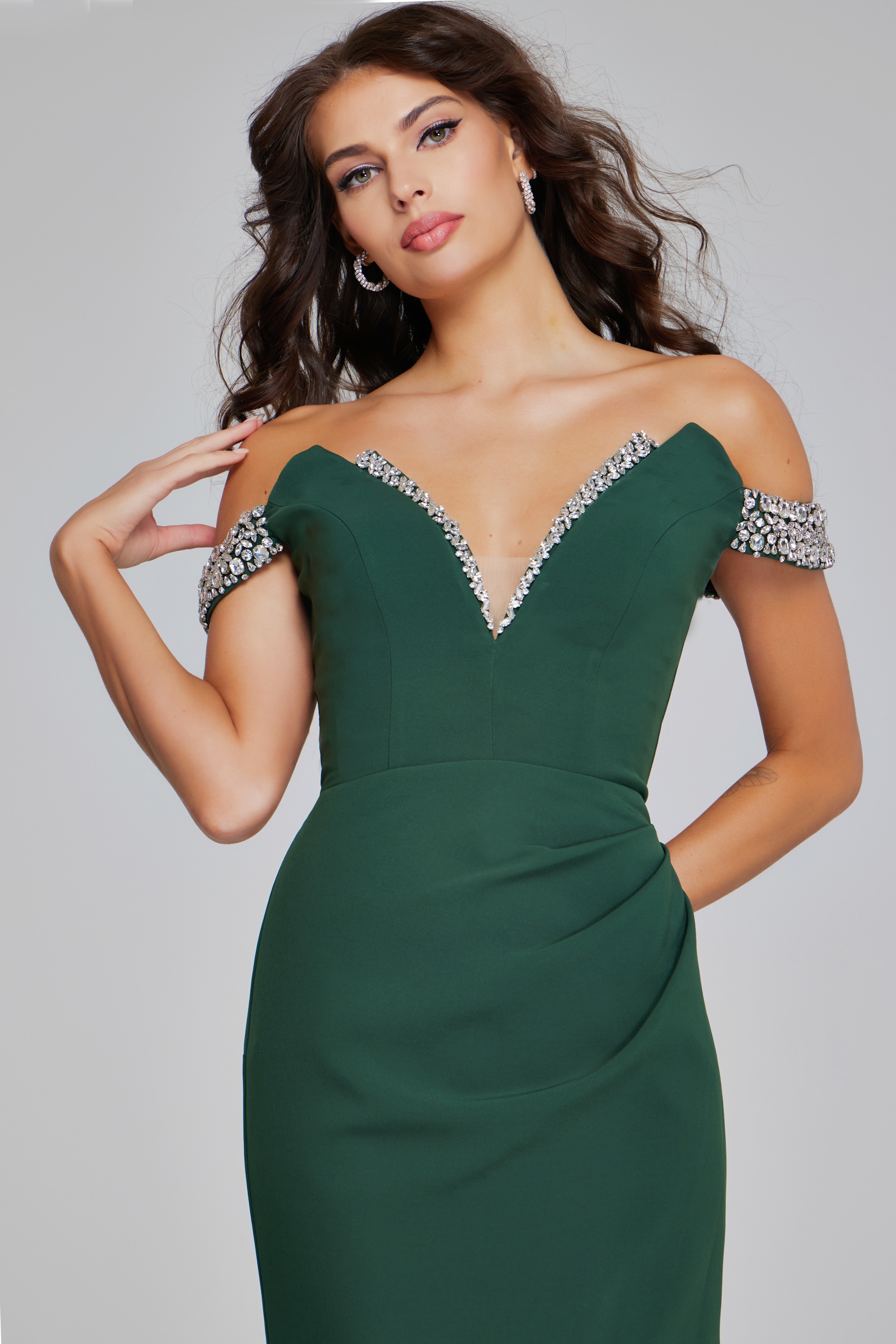 Close-up of Jovani 42394 gown showcasing the beaded off-the-shoulder detail and deep v-neckline.