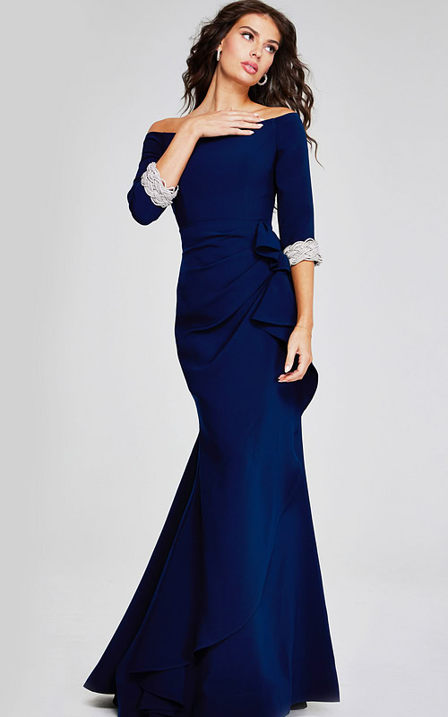 Model wearing Jovani 42409 navy gown with off-the-shoulder neckline from the front view.
