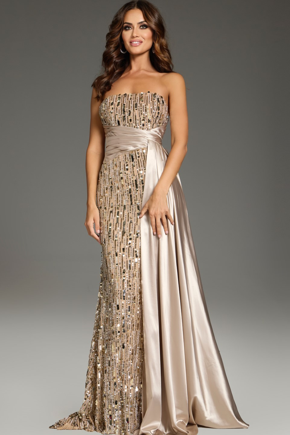 Front view of model wearing Jovani 42427 gown with nude sequins and strapless neckline.
