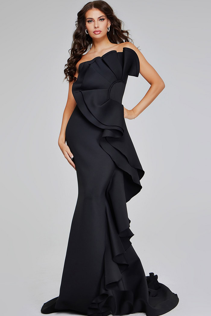 model wearing Jovani 42543 black strapless gown with oversized ruffle detail, front view