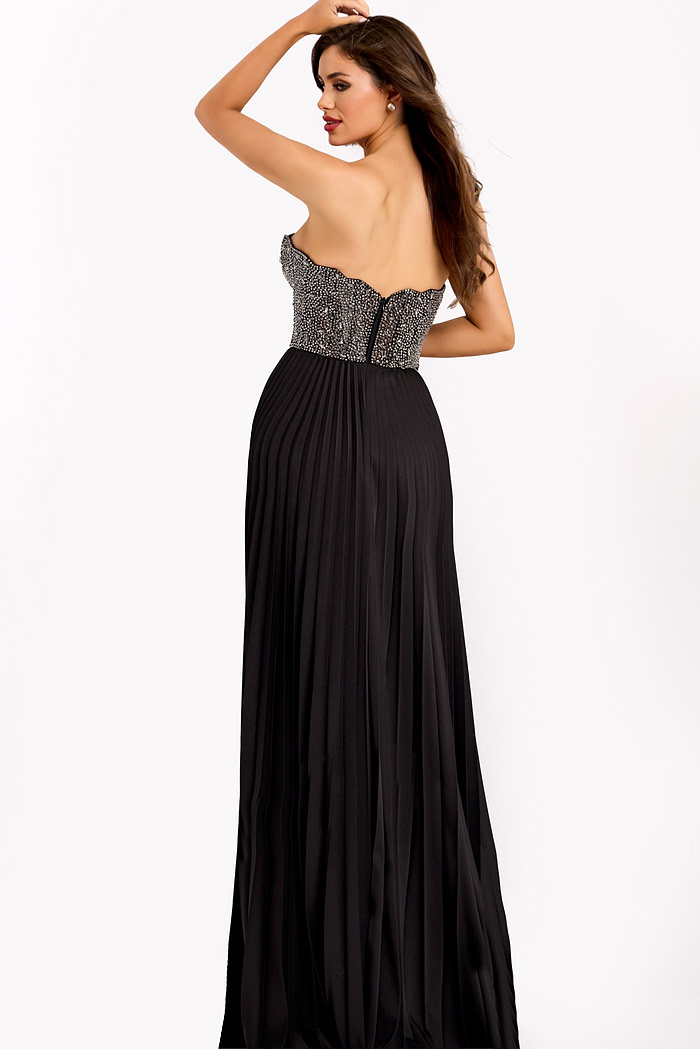 Elegant black gown with pleated skirt and embellished bodice