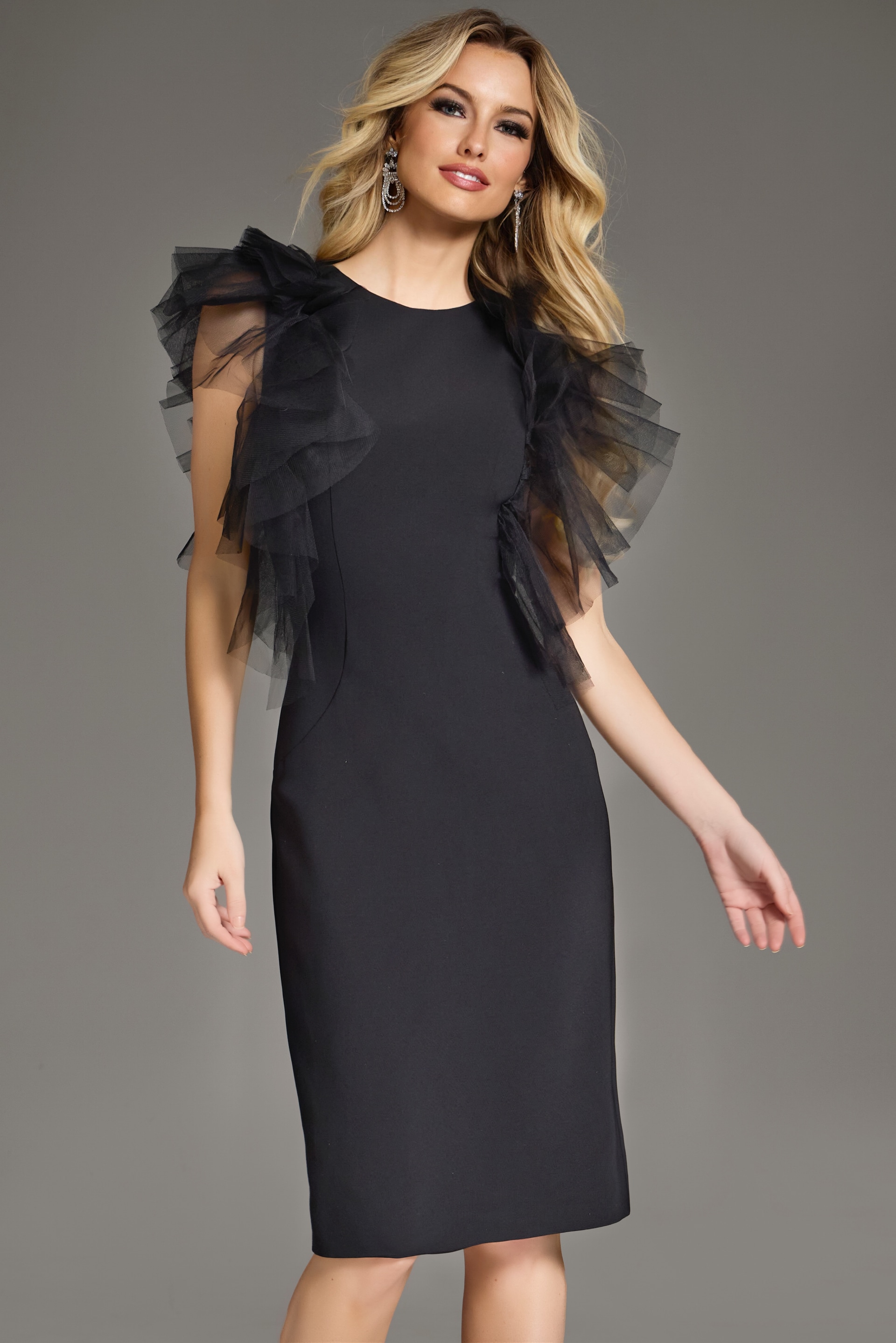 Model wearing Jovani 43152 black dress with ruffle cap sleeves, front view