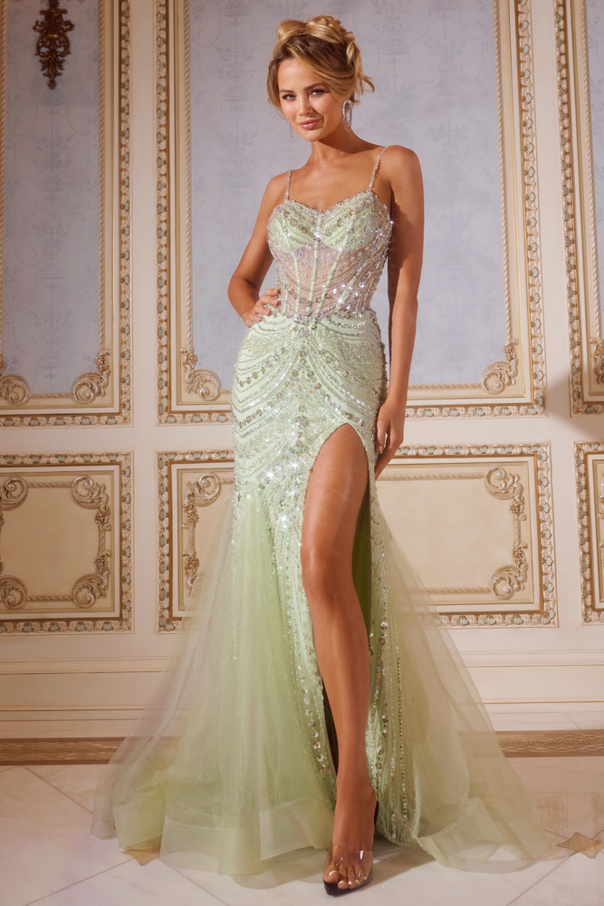 Model wearing Jovani 43189 green gown with delicate beading, floor-length and high slit.