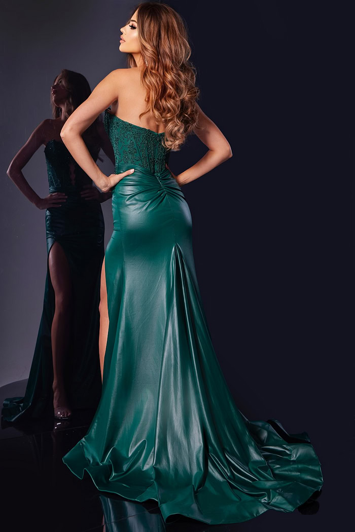 Model showing back view of Jovani 43267 in green with elegant design.