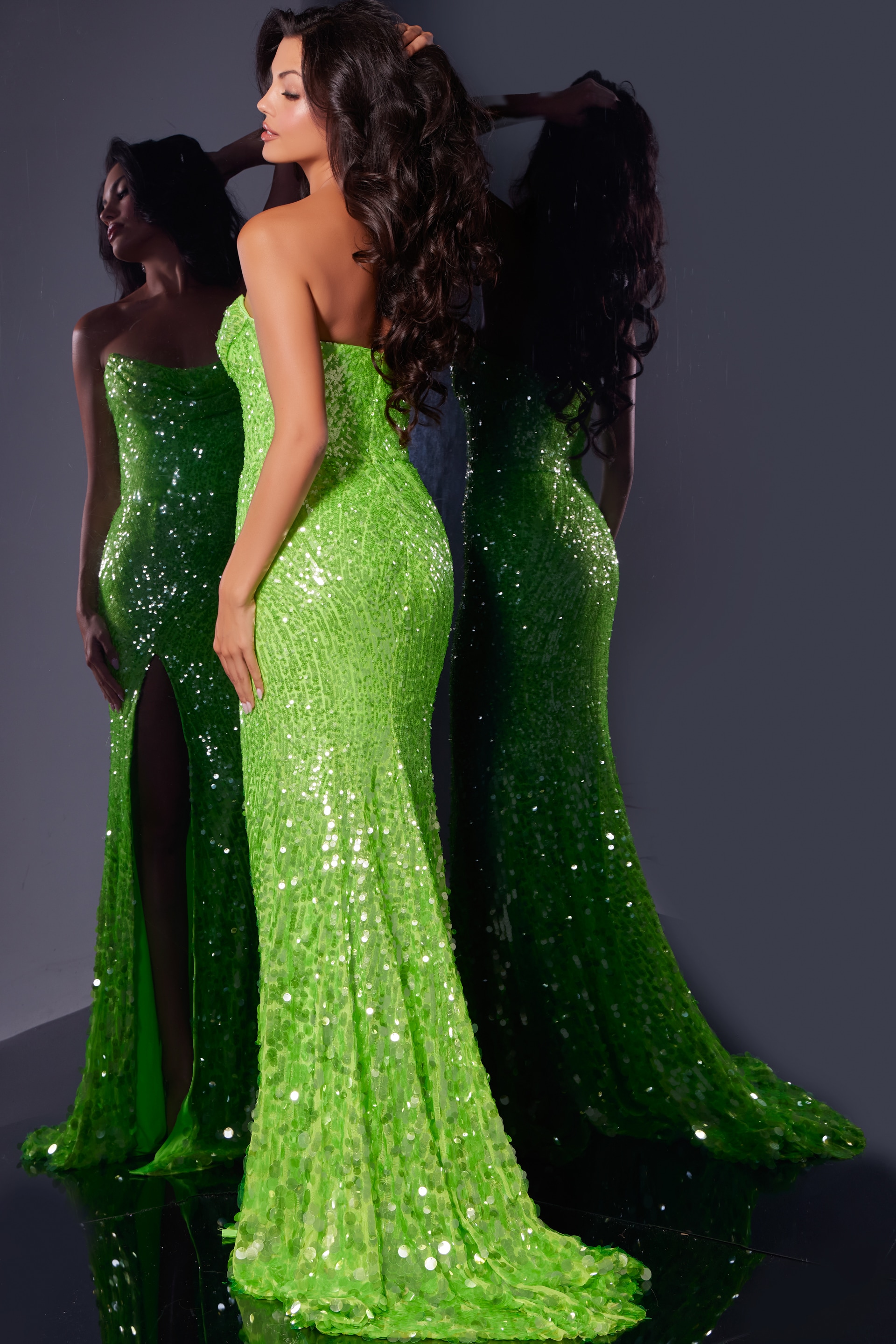 back view of 43338 green sequin gown with train