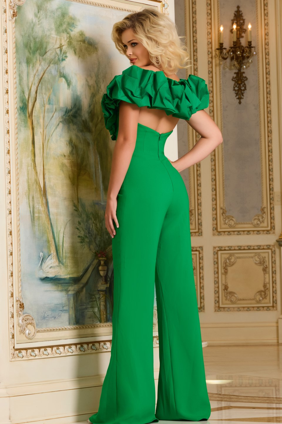 Model wearing Jovani 43504 green jumpsuit back view