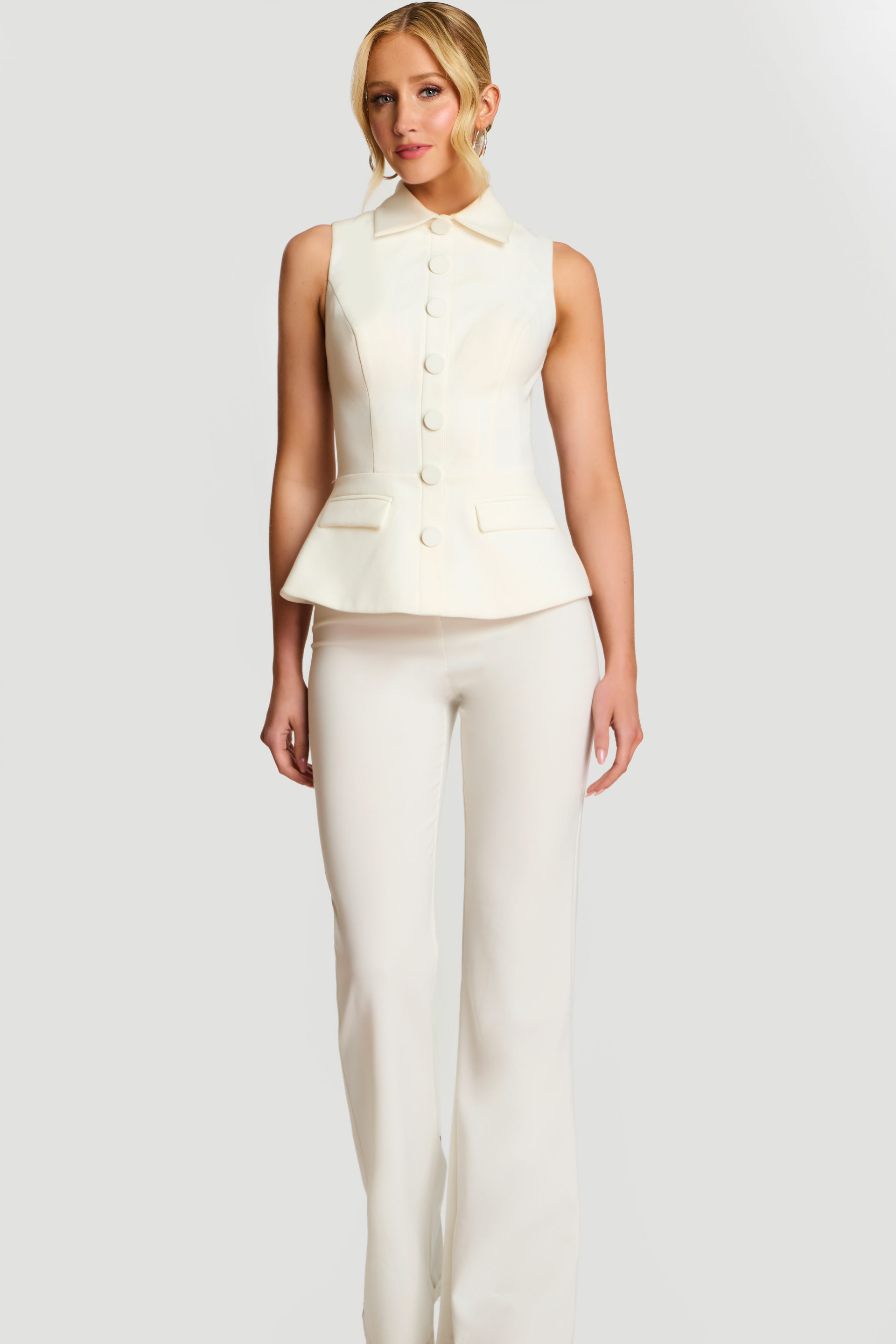 Model Wearing Ivory Sleeveless Tailored Pant Suit With Button Front