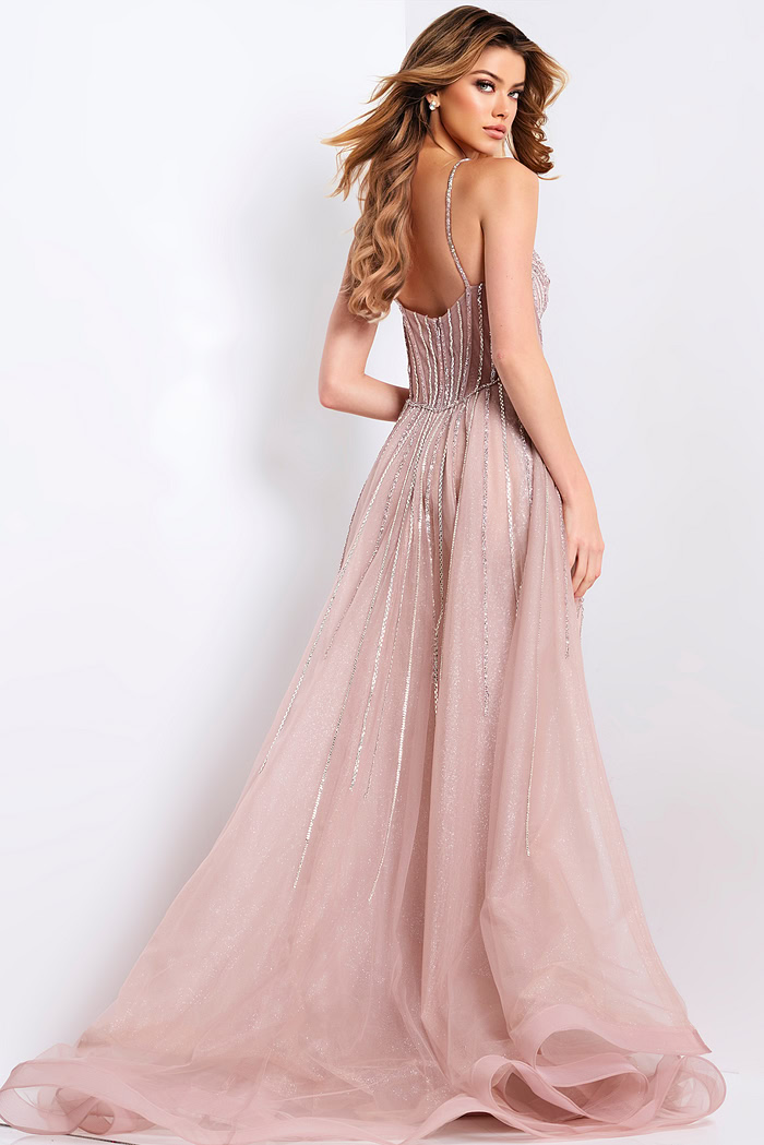 Blush pink prom gown with corset top and shimmering beaded design