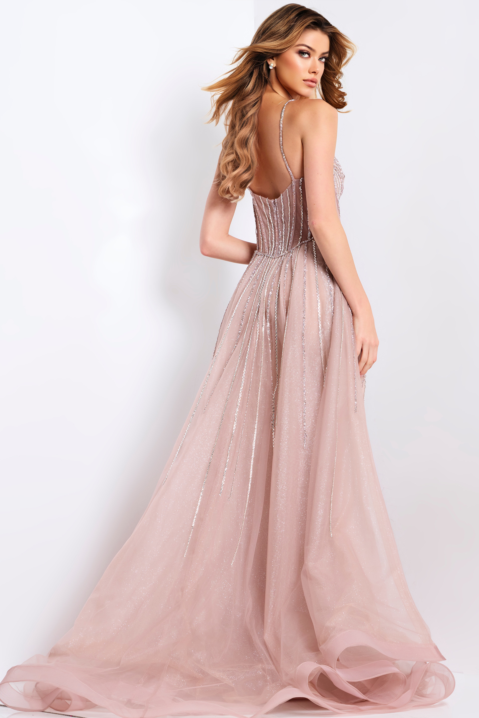 Blush pink prom gown with corset top and shimmering beaded design