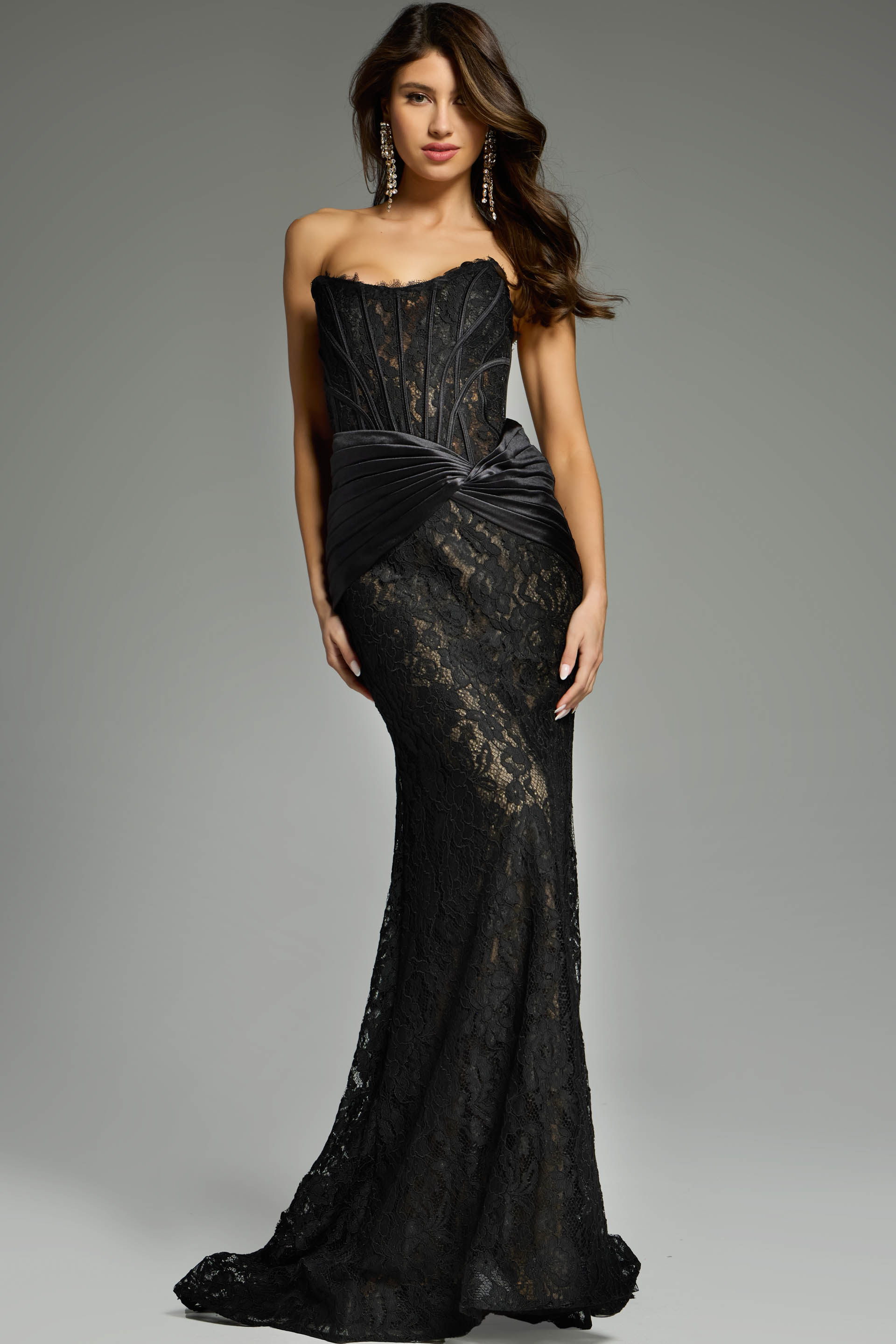Full-length black lace dress with ruched waistline.