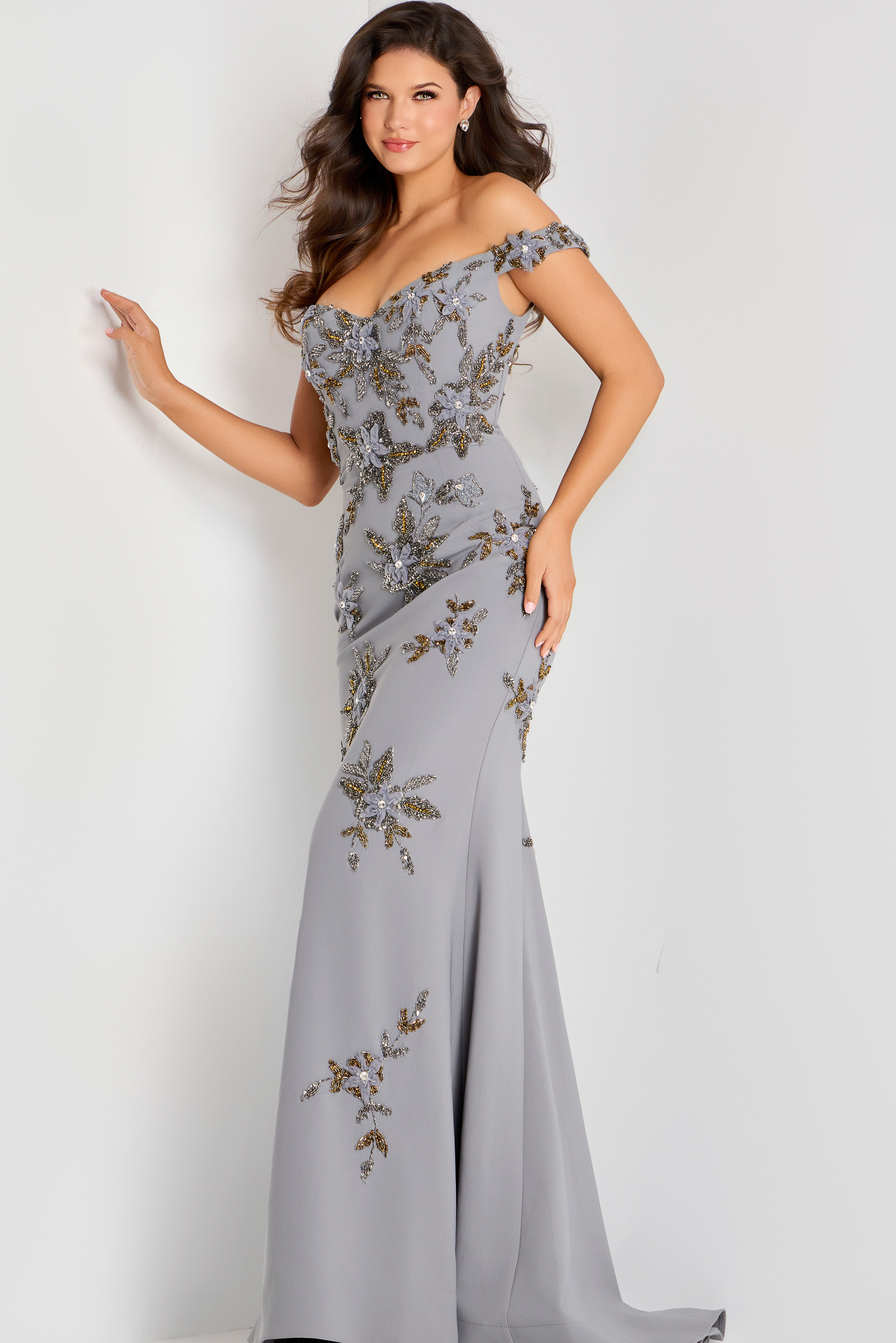 Off shoulder gown adorned with intricate gold and silver floral beadwork, fitted through the bodice and flowing into a soft mermaid silhouette.