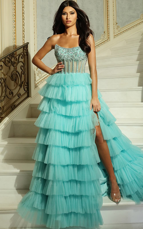 Model wearing strapless beaded corset gown with tiered tulle skirt