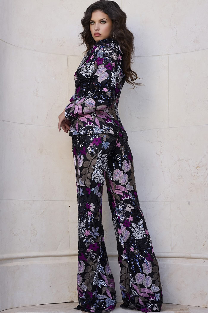 Back view of Jovani 44224 showing the vibrant floral pattern and fit of the jacket and matching pants.