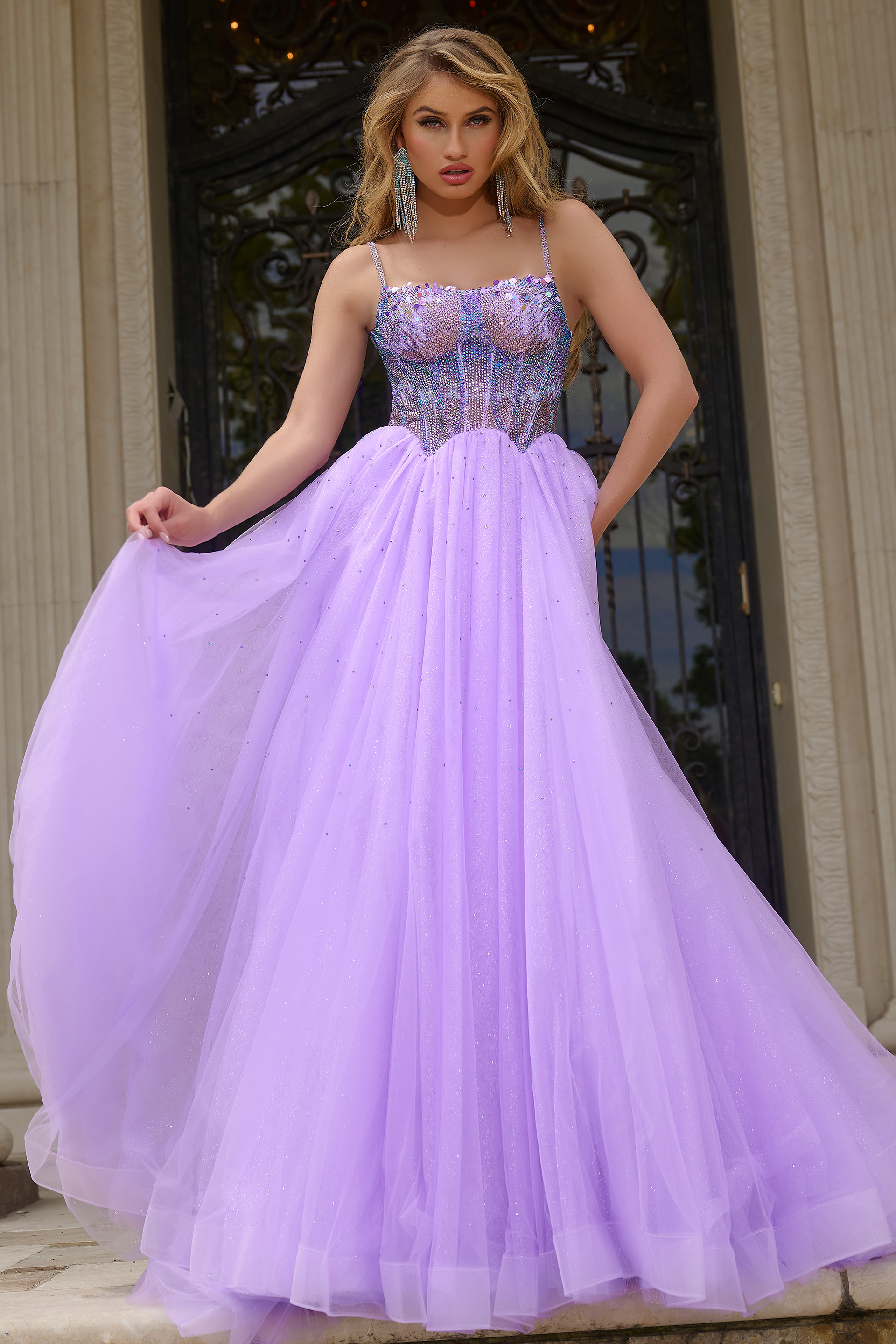 Model wearing Jovani 44511 lilac gown with embellished bodice.