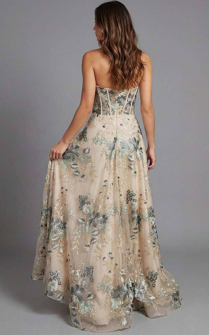 Back view of strapless evening gown with structured corset detailing and flowing skirt