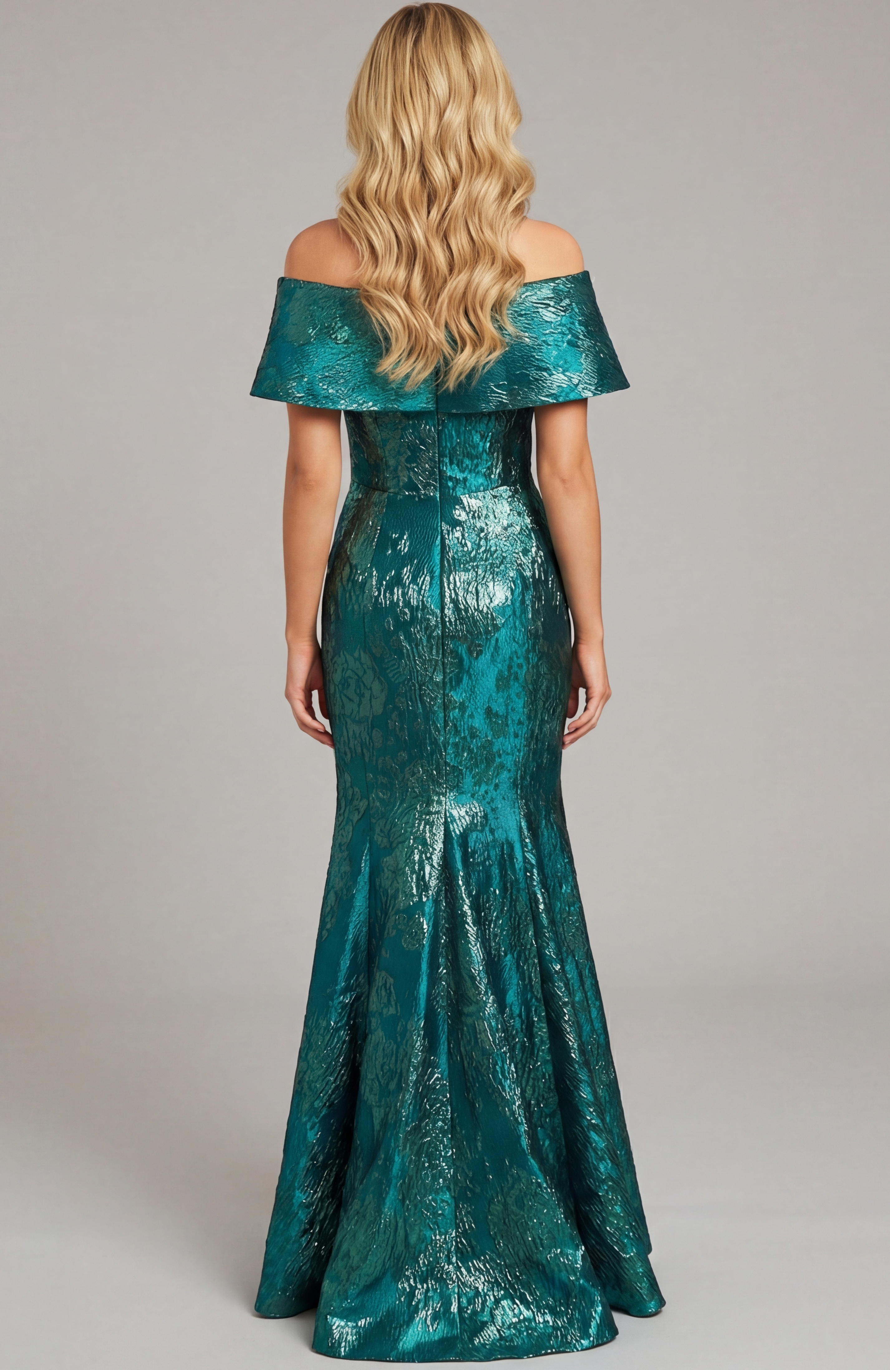 Floor length fitted gown with clean back and smooth flared hem