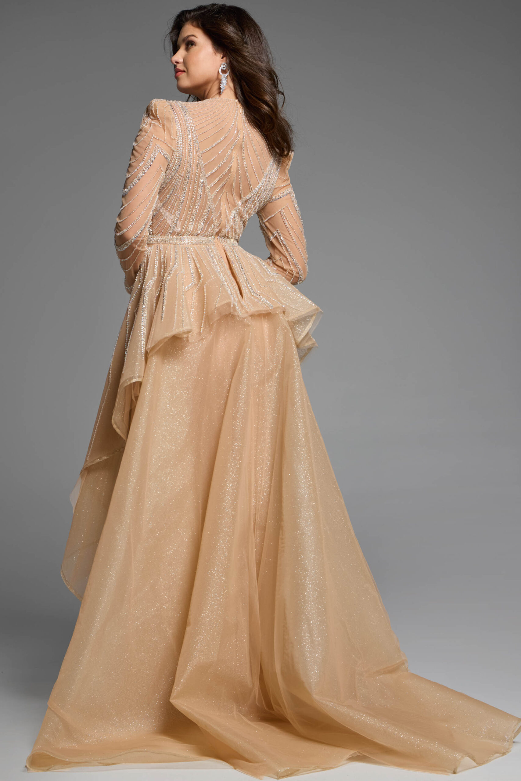 Back view of a beaded gown featuring layered tulle details and a fitted silhouette.