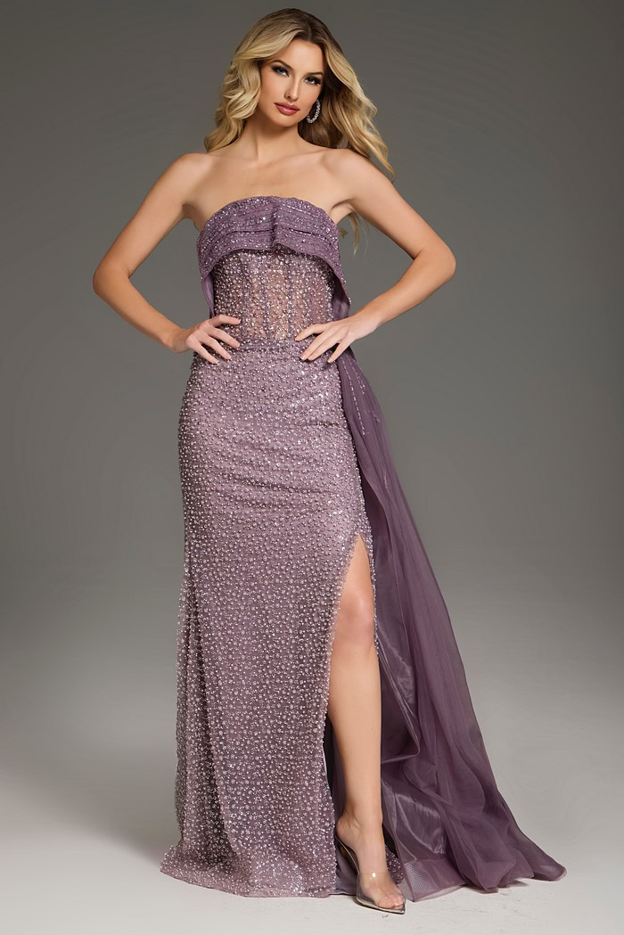 Model wearing Jovani 44842 purple gown with high slit and embellishments.