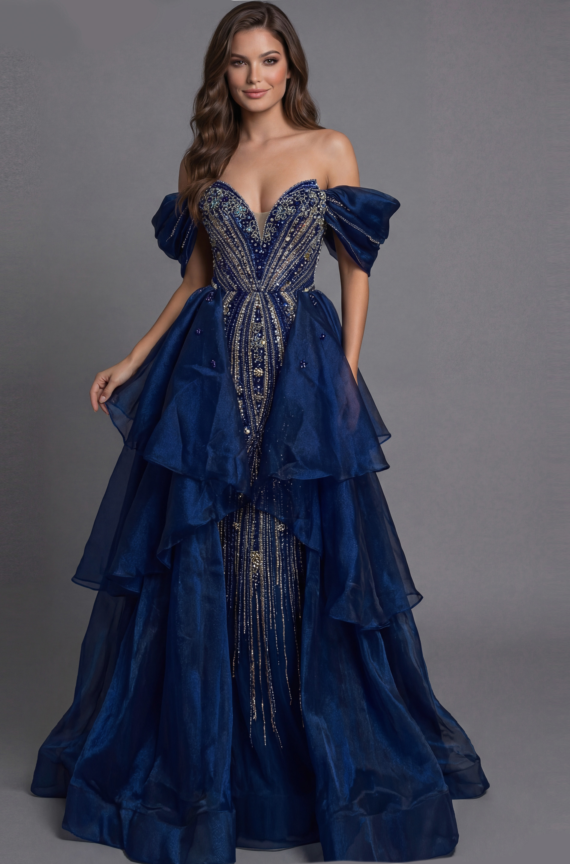Jovani 45076 navy blue off-the-shoulder ball gown with crystal and silver beaded bodice, puff sleeves, deep sweetheart neckline, and tiered layered organza skirt with beaded center panel.