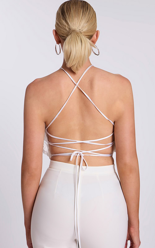Back view of lace-up strappy halter crop top with open back