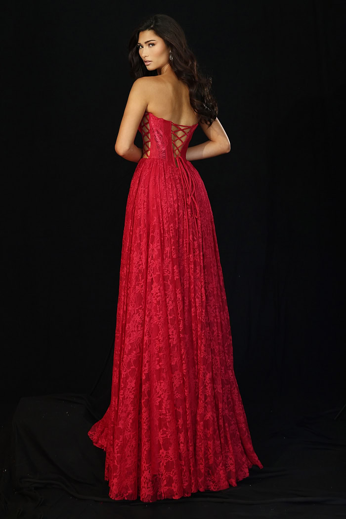 Red lace evening gown featuring lace-up back and flowy skirt