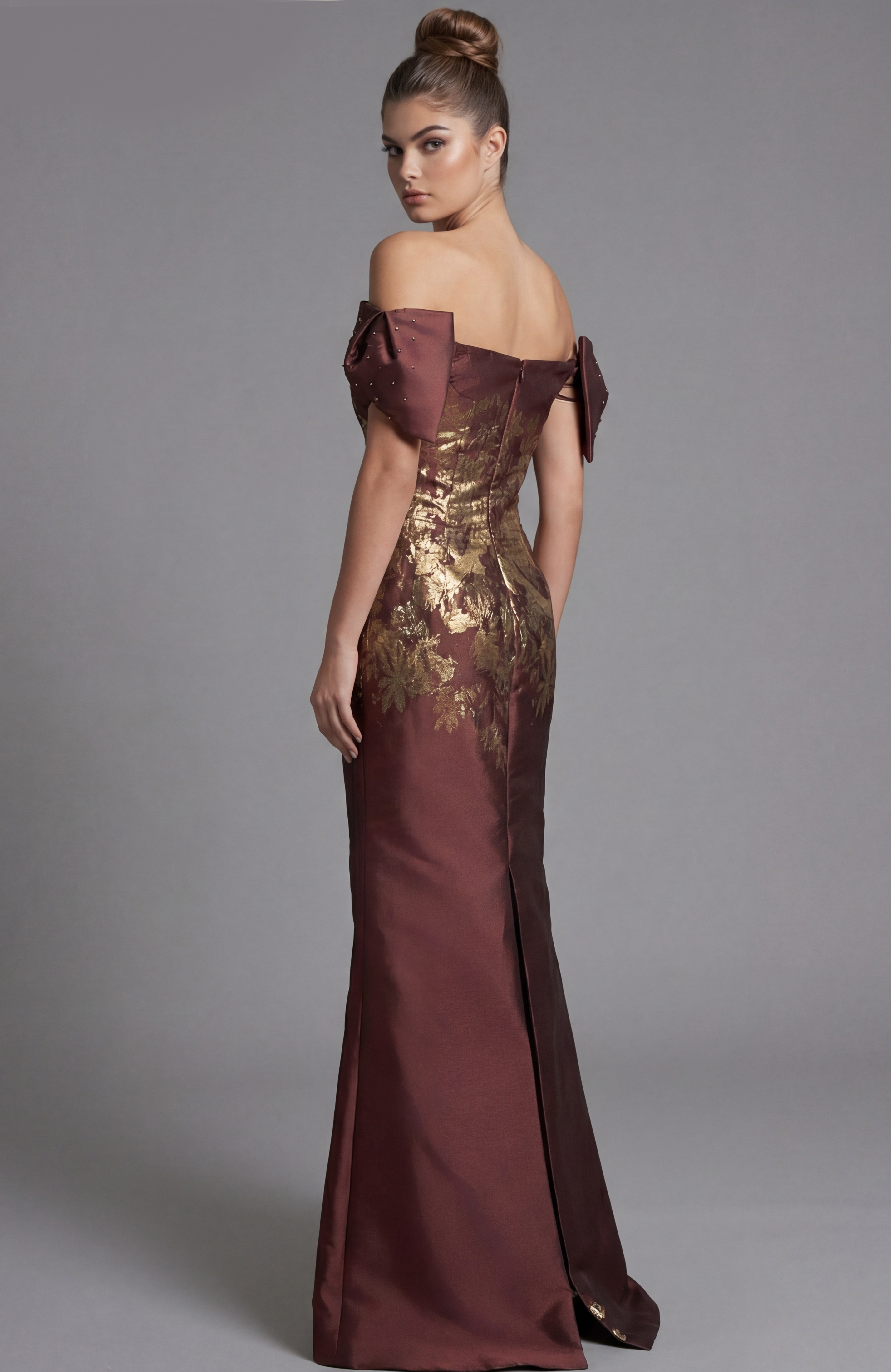 Back view of off shoulder fitted gown with structured puff sleeves and metallic floral bodice